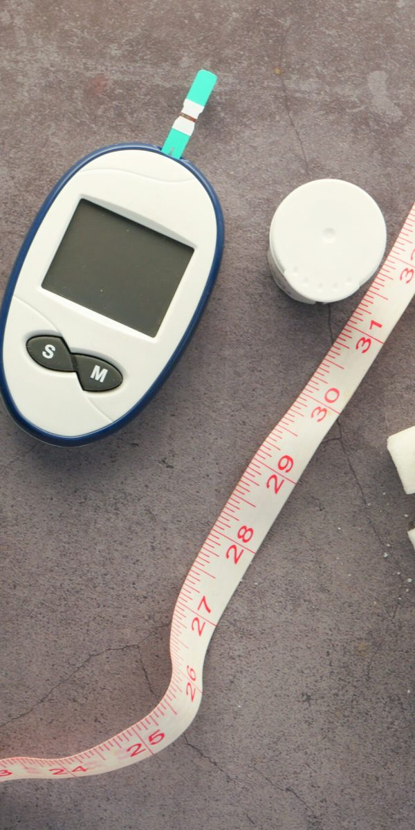 diabetic measurement tools, insulin and sugar cube on black background ,